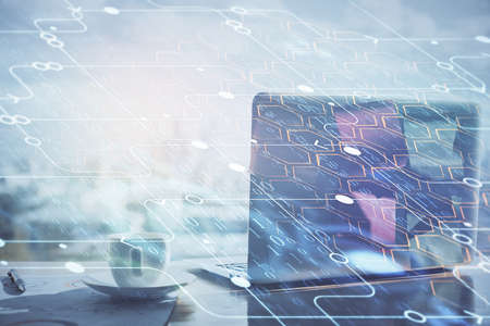 Double exposure of computer and technology theme hologram. Concept of freelance work.