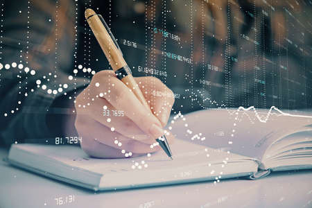 Multi exposure of womans writing hand on background with data technology hologram. Concept of innovation.の写真素材