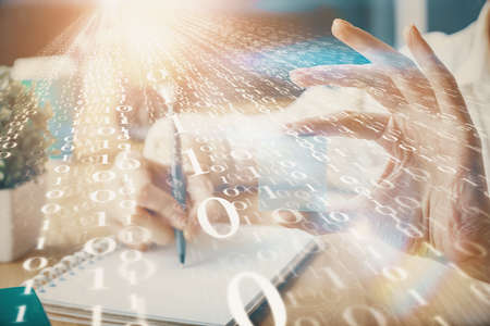 Multi exposure of writing hands on background with data solution hologram. Technology concept.