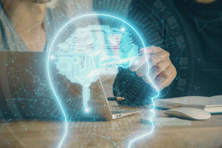 Businessman with computer background with brain theme hologram. Concept of brainstorm. Multi...