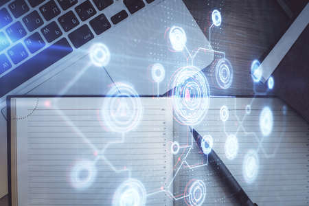 Multi exposure of data theme drawing hologram over topview work desk background with computer....