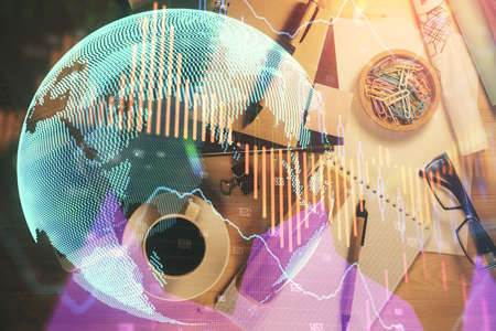 Double exposure of forex graph drawing and work table top veiw. Concept of financial analysis.