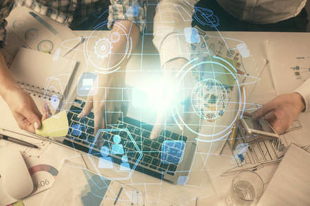 Double exposure of man and woman working together and social network theme hologram drawing....