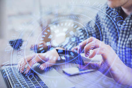 Double exposure of man hands holding a credit card and data theme drawing. E-commerce and technology...