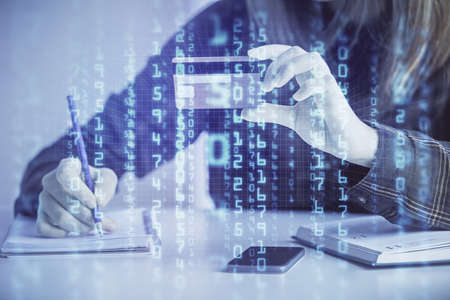 Double exposure of woman on-line shopping holding a credit card and data theme hologram drawing....