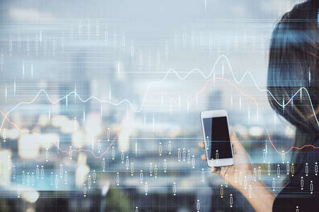 Double exposure of forex chart sketch hologram and woman holding and using a mobile device. Stock...