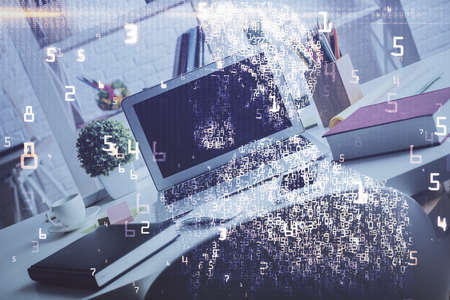 Computer on desktop in office with technology theme hologram. Double exposure. Tech concept.の写真素材