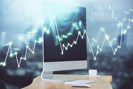 Stock market graph on background with desk and personal computer. Multi exposure. Concept of...