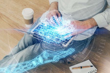 Multi exposure of data internet theme hologram with man working on computer on background. Concept...