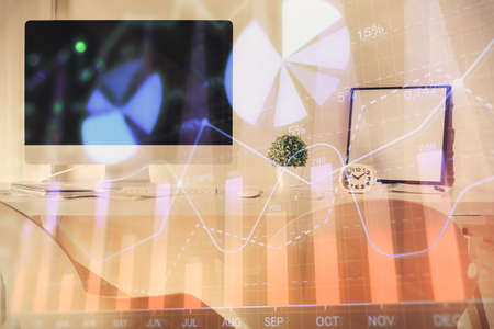 Multi exposure of stock market chart drawing and office interior background. Concept of financial analysis.の写真素材
