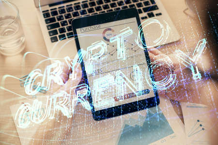 Double exposure of mans hands holding and using a phone and crypto currency blockchain theme drawing.の写真素材