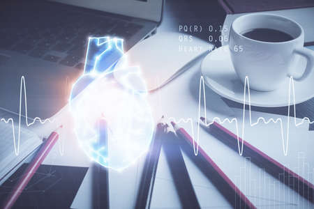 Desktop computer background and heart drawing. Double exposure. Medical study and healthcare...
