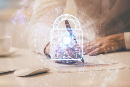 Humans hands with cyber security theme multi exposure background drawings. Concept of online safety.の写真素材