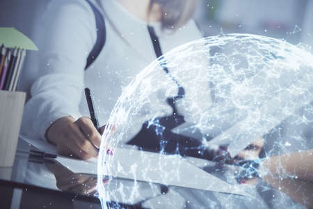 Social network theme hologram over hands taking notes background. Concept of global international people connect. Double exposureの写真素材