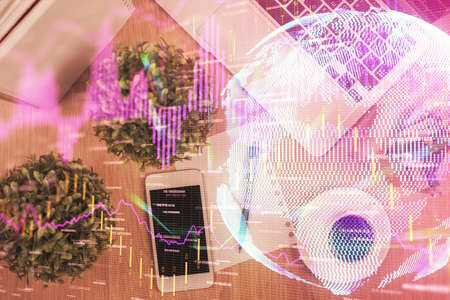 Multi exposure of financial chart hologram over desktop with phone. Top view. Mobile trade platform concept.の写真素材