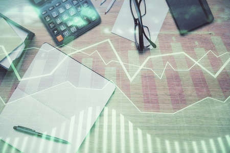 Double exposure of forex graph drawing and work table top veiw. Concept of financial analysis.の写真素材