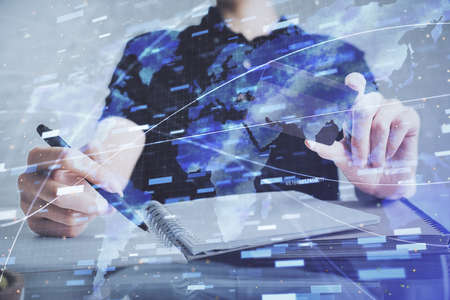 Double exposure of man hands holding a credit card and data theme drawing. E-commerce and technology...
