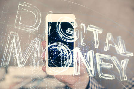 Double exposure of mans hands holding and using a phone and crypto currency blockchain theme drawing.の写真素材
