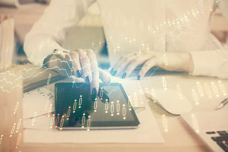 Double exposure of forex chart sketch hologram and woman holding and using a mobile device....