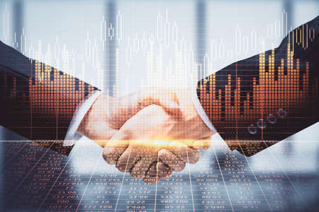 Double exposure of forex graph hologram and handshake of two men. Stock market concept.