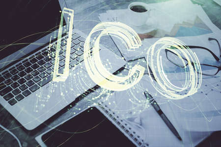 Double exposure of blockchain and crypto economy theme hologram and table with computer background....