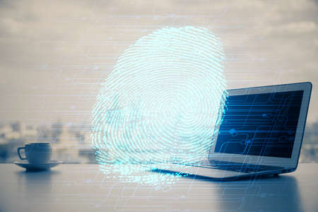 Computer on desktop in office with finger print drawing. Double exposure. Concept of business data...