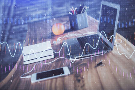 Stock market graph and table with computer background. Double exposure. Concept of financial...