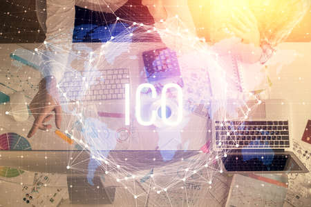 Double exposure of man and woman working together and crypto theme hologram drawing. Computer...