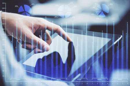 Multi exposure of mans hands holding and using a phone and financial chart drawing. Market analysis...
