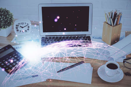 Computer on desktop with social network hologram. Double exposure. Concept of international people...