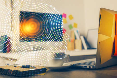 Double exposure of work space with computer and human brain drawing hologram. Brainstorm concept.