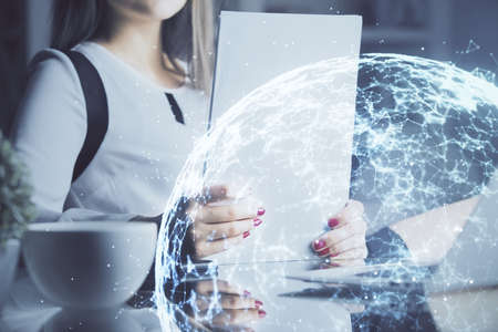 Social network theme hologram over hands taking notes background. Concept of global international...