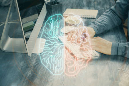 Man typing on keyboard background with brain hologram. Concept of big Data. Double exposure.