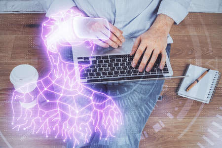 AR hologram with man working on computer on background. Augmented reality concept. Double exposure.