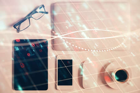 Multi exposure of financial chart hologram over desktop with phone. Top view. Mobile trade platform...