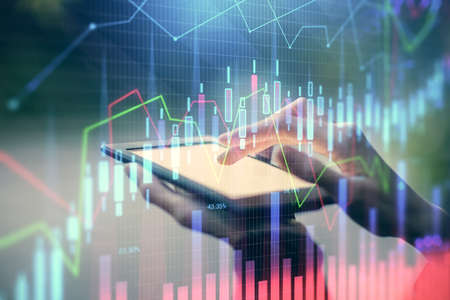 Double exposure of forex chart sketch hologram and woman holding and using a mobile device....