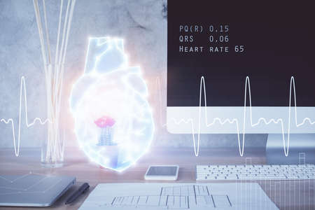 Desktop computer background and heart drawing. Double exposure. Medical study and healthcare...