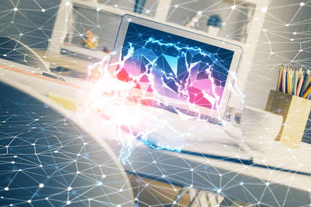 Double exposure of work space with computer and human brain drawing hologram. Brainstorm concept.