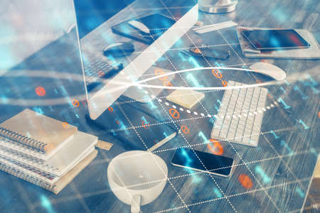 Multi exposure of chart and financial info and work space with computer background. Concept of international online trading.の写真素材