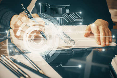 Double exposure of writing hands on background with data solution hologram on front. Technology...