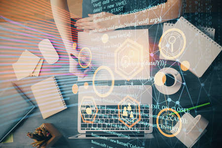 Multi exposure of writing hands on background with data solution hologram. Technology concept.