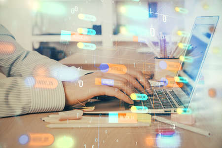 Businessman working on Laptop with technology theme drawing. Concept of big data. Double exposure.の写真素材