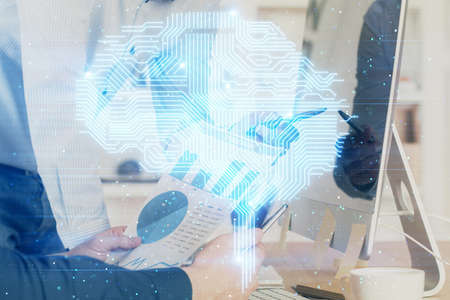Man with computer background with brain theme hologram. Concept of brainstorm. Double exposure.