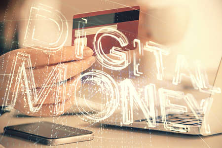 Multi exposure of woman on-line shopping holding a credit card and crypto theme drawing. Blockchain E-commerce concept.の写真素材