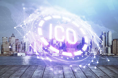 Double exposure of crypto currency theme hologram drawing and city veiw background. Concept of blockchain and bitcoin.の写真素材