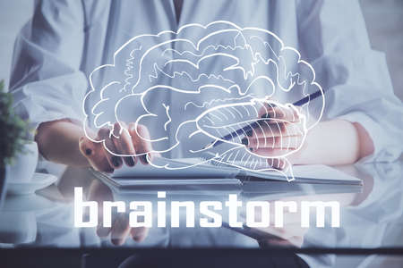 Start up creative drawing over close up hands on background. Concept of brainstorming. Multi...