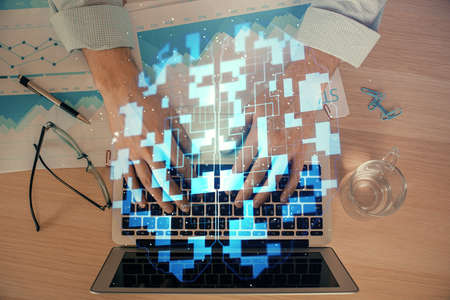 Businessman with computer background with technology theme hologram. Concept of big data. Double...
