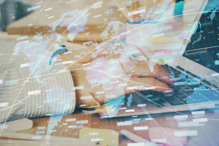 Businessman working on Laptop with technology theme drawing. Concept of big data. Double exposure.の写真素材