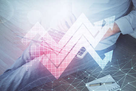 Growing arrows with businessman working on computer on background. Success concept. Double exposure.の写真素材