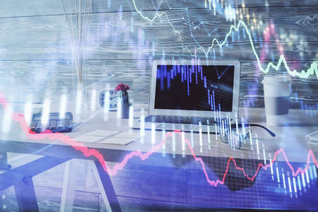 Double exposure of financial graph drawing and office interior background. Concept of stock market.